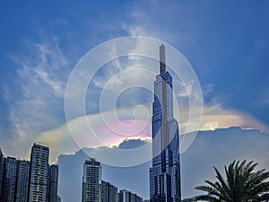 A tall building with a rainbow on top