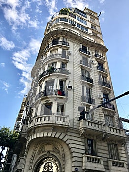 Tall building with windows and balconies and street light