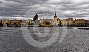 Tall buildings situated on the bank of the Vltava river