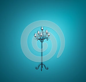 Tall candle holder on blue background