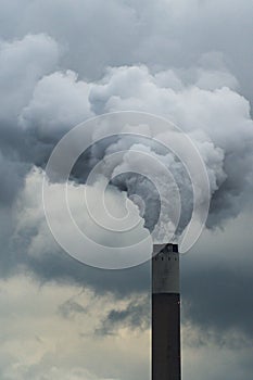 Tall chimney emitting smoke and pollutants