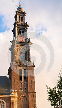 Tall church tower rising skyward with Gothic architectural detail