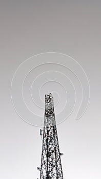 A tall Communication towers with a clear sky.