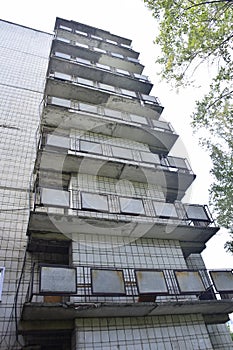 a tall concrete building with metal balconies. Ulyanovsk