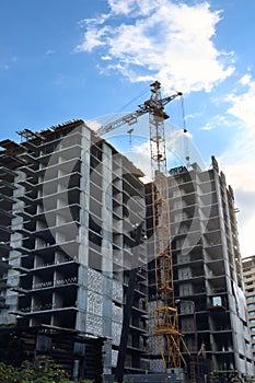 Tall concrete residential building under construction