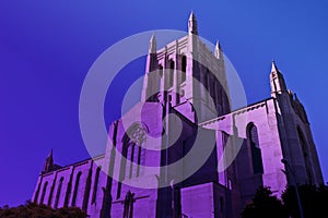 Tall downtown Los Angeles Catholic Church in twilight purple haze.