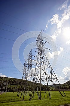 Tall electrical transmission towers at hydro-electric dam