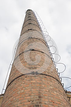 Tall factory chimney, portrait orientation