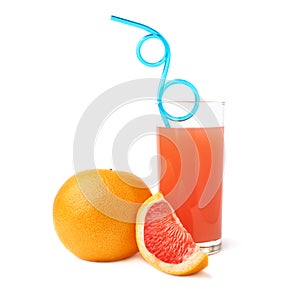 Tall glass filled with the grapefruit juice, blue curved drinking straw and fruits, composition isolated over the white