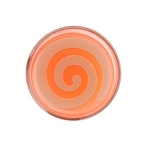 Tall glass filled with the grapefruit juice isolated over the white background