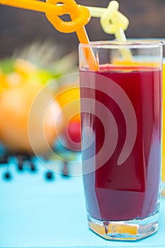 Tall glass of freshly squeezed fruit juice