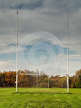 Tall goal post on training pitch for Irish National sport camogie, hurling, rugby and Gaelic football Nobody. Cloudy sky. Popular