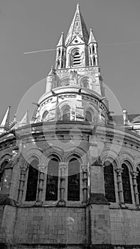 The tall Gothic spire of an Anglican church in Cork, Ireland. Neo-Gothic Christian religious architecture. Cathedral Church of St