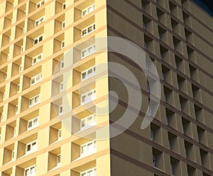 Tall high rise council flats against blue sky