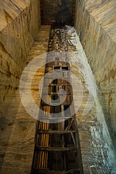 Tall impressive wall in Slanic Prahova salt mine, underground extraction pit, Romania