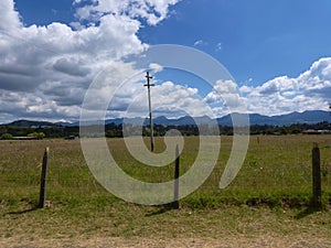 Electricity pole in middle of the field