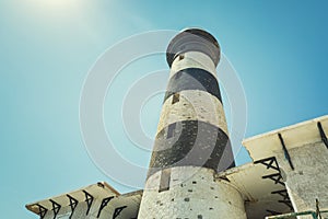 Tall lighthouse on the sea