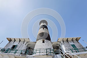 Tall lighthouse on the sea
