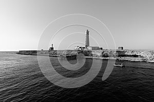 Tall lighthouse on the sea