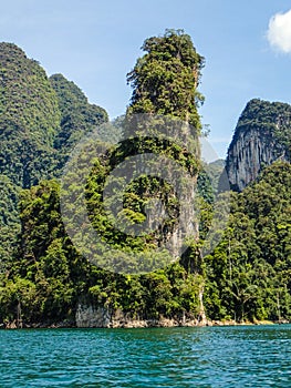 Tall limestone cliffs at Khao Sok lake photo