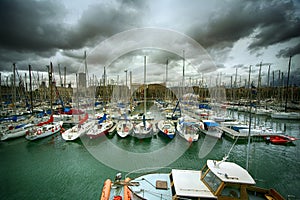 Tall luxury boats and yachts moored in duquesa Port In Spain. Barcelona