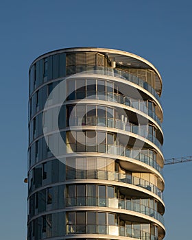 Tall, majestic building with multiple balconies.