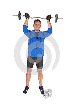 Tall man lifting the weight over his head