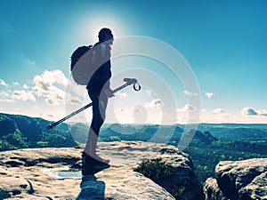 Tall man taking an excursion on a mountain. Mountain hiker