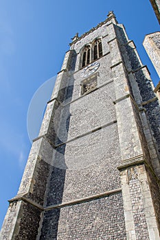 Tall medieval church building clock tower from Cromer UK