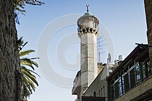 Tall minaret at the end of Via Dolorosa street in old city of Jerusalem, Israel