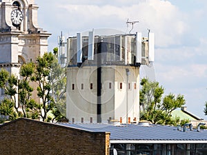 A tall mobile telecommunications tower with aerial antenna for mobile transmitters.