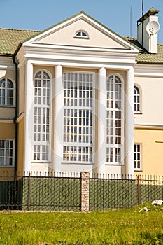 Tall modern building with large pillars