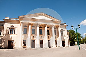Tall modern building with large pillars