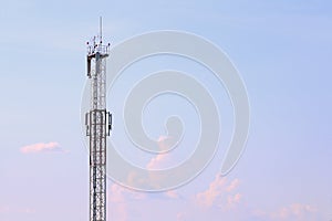 Tall modern cell tower, clouds and beautiful sky