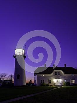 Tall Nightscape of Light House against Clean Blue Sky. Chatham Light House on Cape Cod.