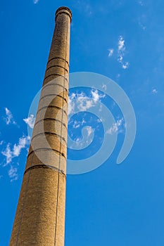 Tall and old brick chimney