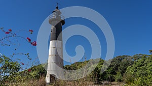 A tall old lighthouse on a tropical island. Madagascar. Nosy Iranja