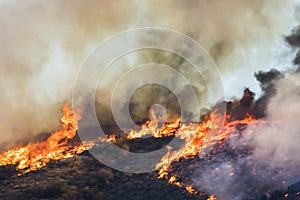 Tall Orange Flames Burn Hills During California Woolsey Fire