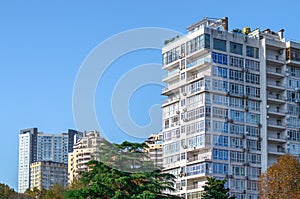 Tall residential building against the background of other buildings