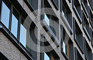 tall residential building detail (windows, lines, symmetry, asymmetry) building detail