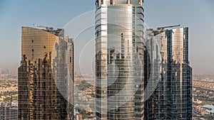 Tall residential buildings at JLT aerial timelapse, part of the Dubai multi commodities centre mixed-use district.