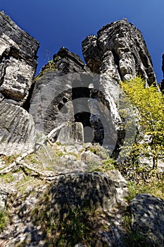 Tall rock formations under a deep blue sky