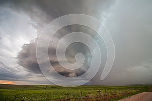 The tall, rotating updraft of a supercell thunderstorm towers over the plains in eastern Wyoming. photo