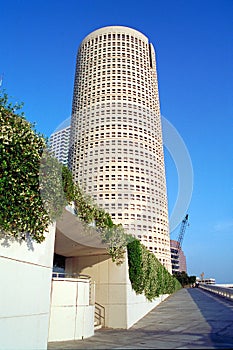 Tall round building near river in Tampa Florida photo