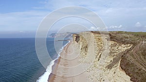 Tall Sandstone Cliffs of West Bay Along the Jurassic Coast of Southern England
