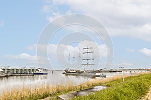 a tall ship is docked in the water next