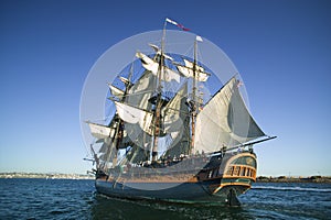 Tall ship sailing at sea under full sail