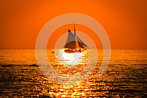 Tall ship sailing at sunset on Lake Michigan in South Haven Michigan