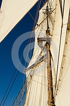 Tall ship sails in sunny day