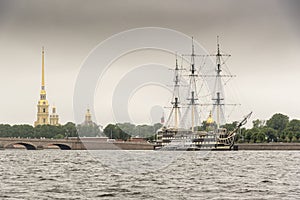 Tall ship Veter on the Neva River St Petersburg with St Peter and Paul Cathedral.